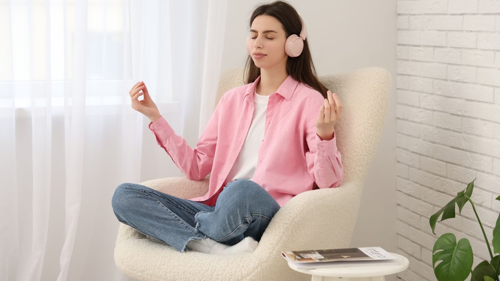 how to make meditation easier at home. A woman in a chair meditating