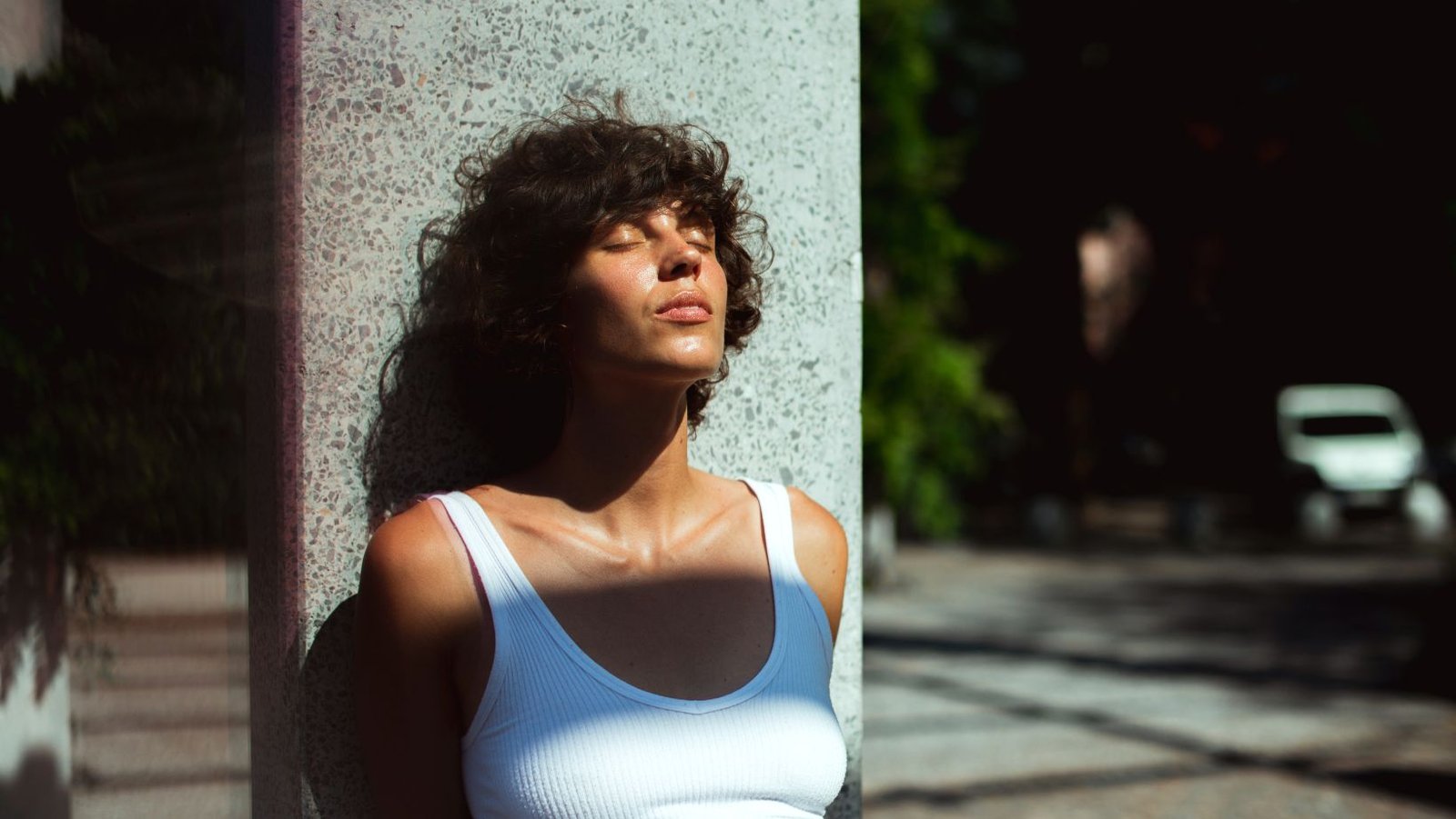 Woman standing in the sun feeling lost after achieving a goal