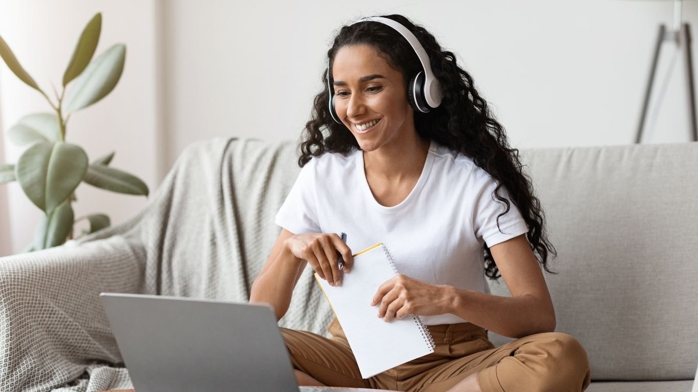 a woman sits studying a course about mindfulness for everyday life