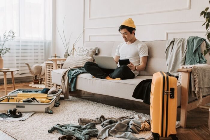 Person distracted by phone in cluttered space showing environmental impact on behavior