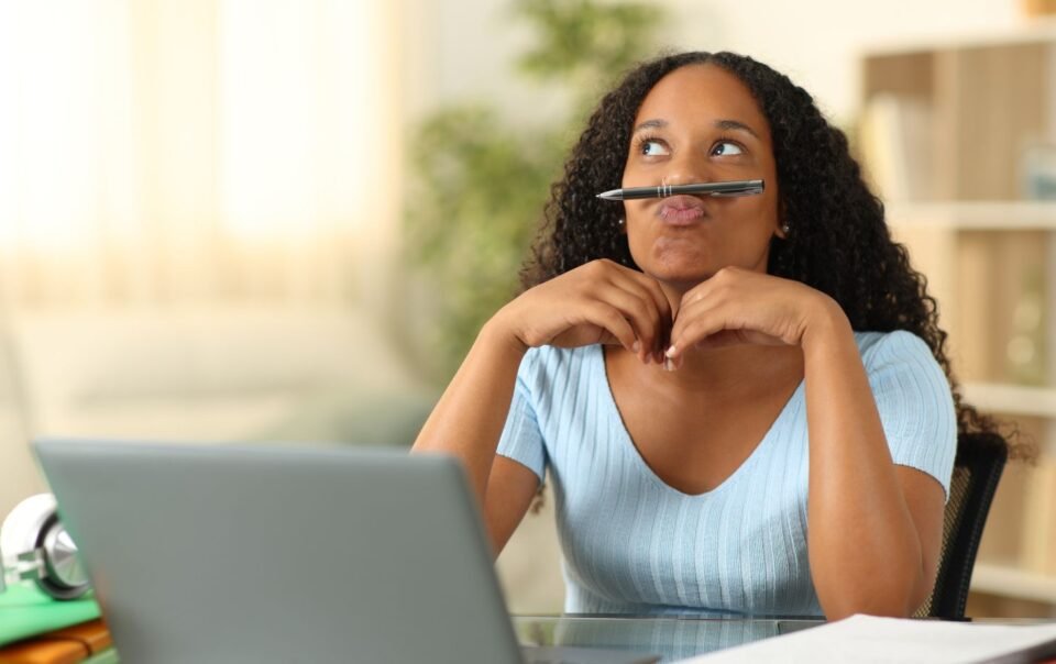 Person procrastinating and avoiding work despite knowing it matters