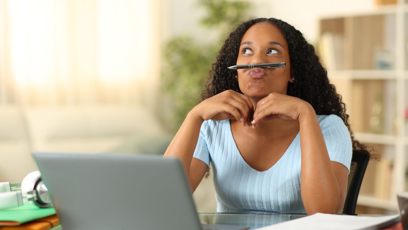 Person procrastinating and avoiding work despite knowing it matters