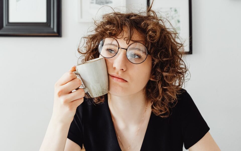 Woman thinking deeply before taking action and delaying progress